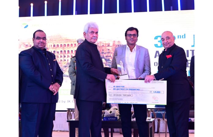 LG Manoj Sinha felicitating winner of JK Cement’s Architect of the Year Award on Thursday.