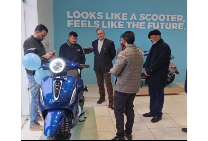 NSF Bajaj officials and other guests during launch of Electric Chetak Scooter at their new showroom in Satwari, Jammu.