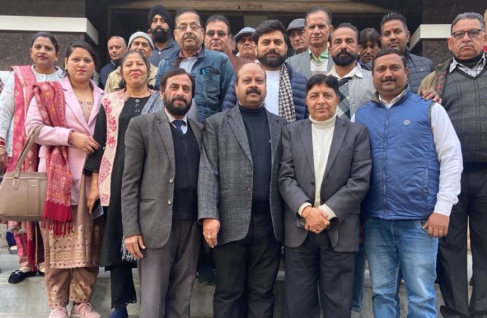 Congress leader, Naresh Gupta poses for a group photograph with other party leaders of Samba and Reasi on Sunday.
