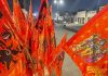 Saffron flags bearing images of Lord Ram, Lord Hanuman and the upcoming grand temple on display in front of shops along Ram Path, in Ayodhya. Ahead of the Ram temple consecration ceremony in the holy city, demand for such flags has risen manifold.