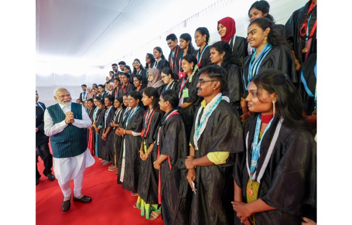Prime Minister Narendra Modi meeting with students at the 38th Convocation Ceremony of Bharathidasan University, in Tiruchirappalli on Tuesday. (UNI)