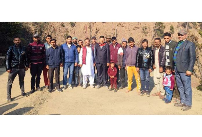 Members of tribal Gaddi community people posing for a group photograph after a meeting at a remote village in Ramban on Sunday.