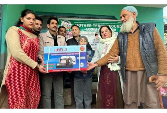 Mother Teresa Foundation J&K president, Maheen Malik along with others gives sewing machines to poor ladies in Kishtwar.