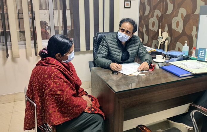 Dr Suresh Kaul from Amandeep Hospital Pathankot giving consultation to a patient at special OPD session in Jammu.