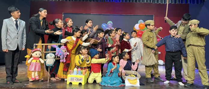Young artists of Natrang performing in Balwant Thakur's play 'Rang Badalti Duniya' at Jammu on Friday.