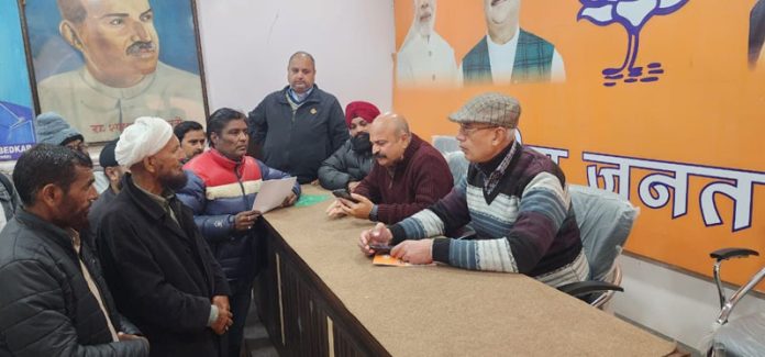 BJP vice president, Yudhvir Sethi listening public grievances at Jammu on Thursday.