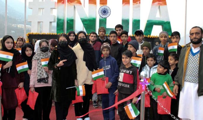 Youngsters holding the national flag posing with #INDIA Selfie point at Uri on Wednesday. 