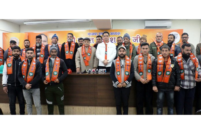 BJP leaders taking new entrants into party fold at Jammu on Monday.