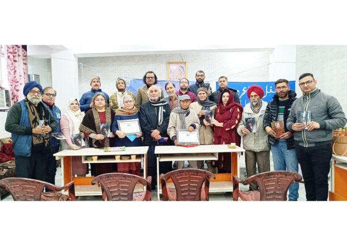 Poets posing during a Poetry Meet organised in Jammu on Monday.