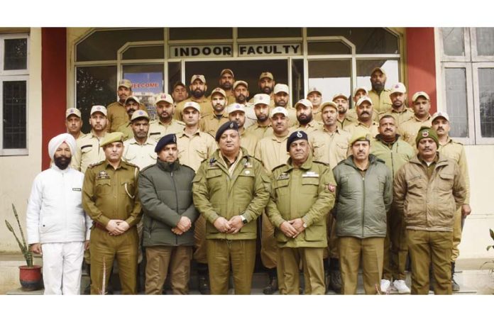 Dushyant Sharma, SSP, Incharge Principal PTTI Vijaypur posing with officers and trainees.