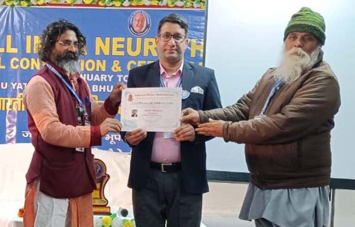 A neurotherapist receiving certificate during 24th Neurotherapy Annual Convention on Thursday.