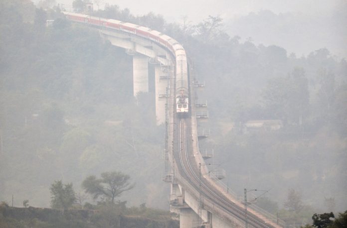 A train moves slowly amidst dense fog near Jammu on Wednesday morning. -Excelsior/Rakesh