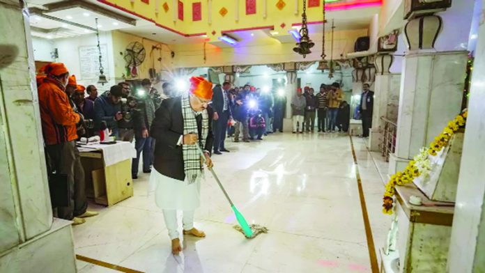 BJP National President JP Nadda during a cleanliness drive at Guru Ravidas Mandir ahead of the Pran Pratishtha of Ram Lala, in New Delhi.