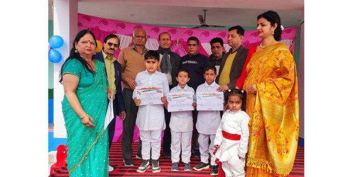 Students posing along with certificates.