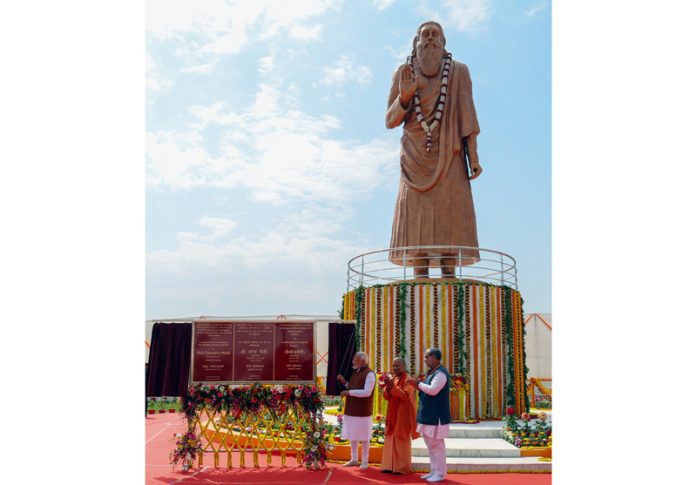 Prime Minister Narendra Modiunveils the statue of Sant Guru Ravidas at Varanasi, in Uttar Pradesh on Friday. (UNI)