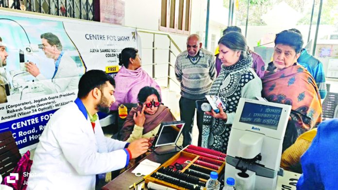 A doctor examining patients during an eye camp in Jammu on Monday.