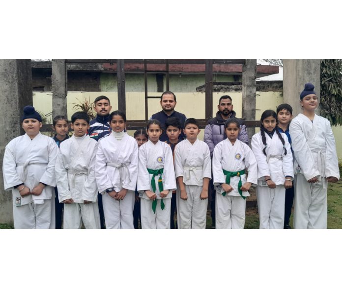 Chief Guest posing along with Karate players on Wednesday.