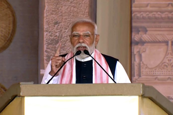 Prime Minister Narendra Modi addressing after the inauguration and foundation stone laying of various developmental projects, in Guwahati on Sunday. UNI