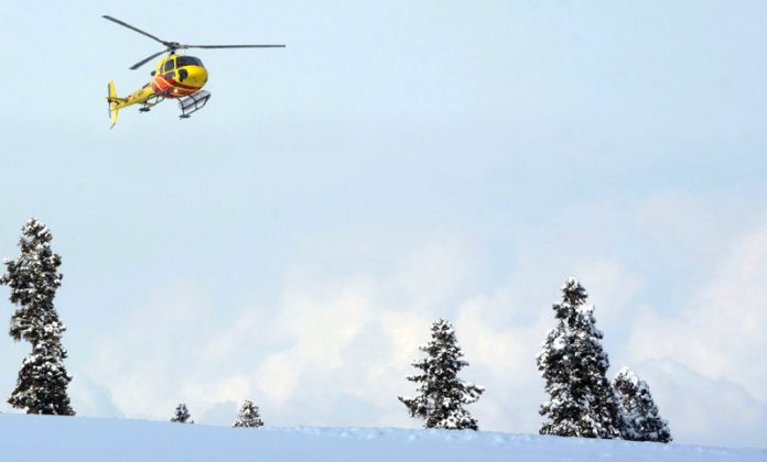 Helicopter carrying rescue workers leaving for searches after snow avalanche on Apharwat Peaks at Kongdoori in Gulmarg. -Excelsior/Shakeel