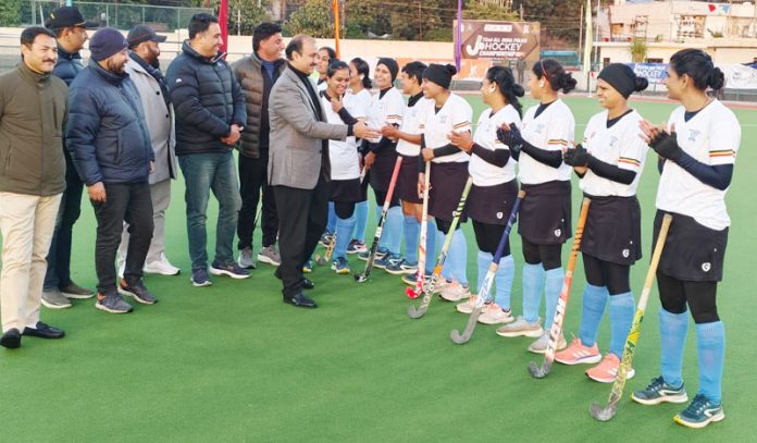 Member J&K Sports Council Ranjit Kalra interacting with hockey players at KK Hakku Stadium in Jammu on Sunday.
