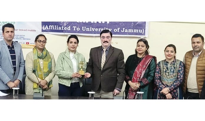 Government Degree College Marh Principal presenting trophy to resources person during organ donation awareness programme.