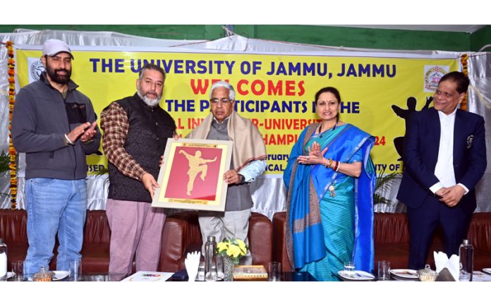 Memento being presented to Prof. Umesh Rai, Vice Chancellor, University of Jammu on Tuesday.