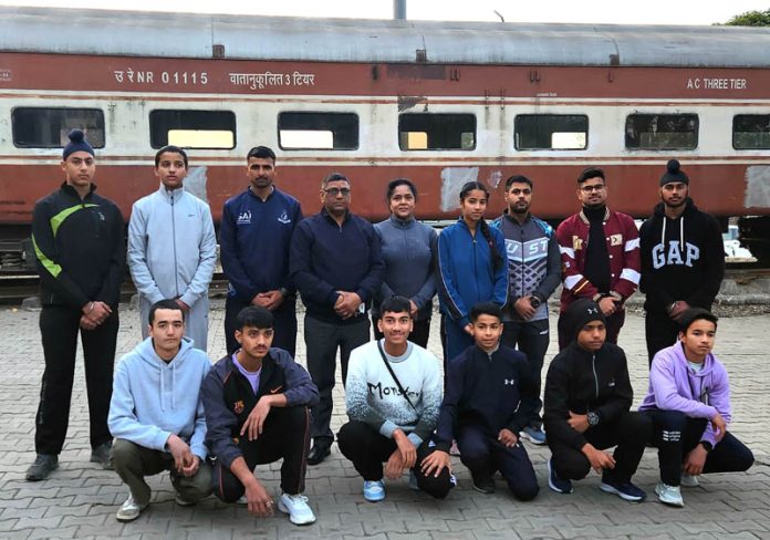 Jammu District Athletics team posing for group photograph at Jammu on Tuesday.