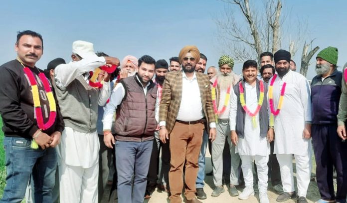 Congress leader Taranjit Singh Tony along with others posing for a photograph during a joining function at Suchetgarh on Wednesday.