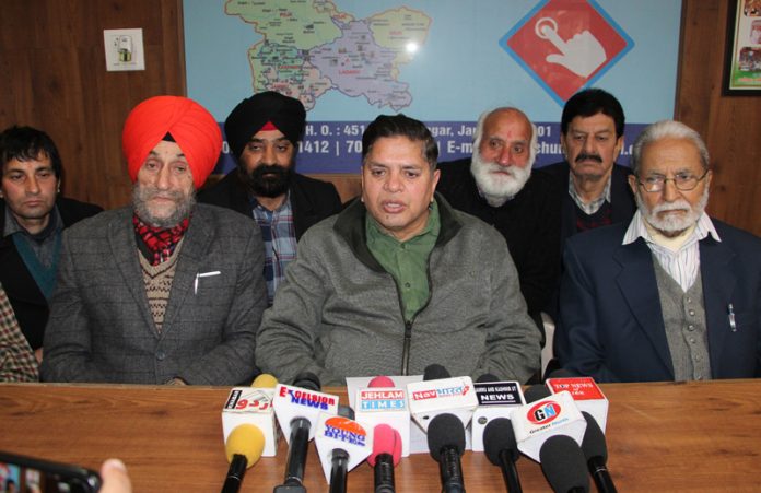 Rajiv Chuni addressing a press conference at Jammu.