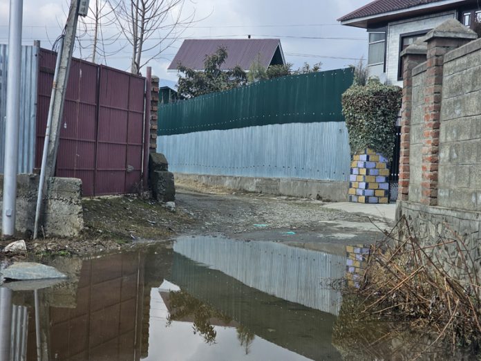 A view of waterlogged road in Millat Colony Delina in Baramulla. -Excelsior/Aabid Nabi