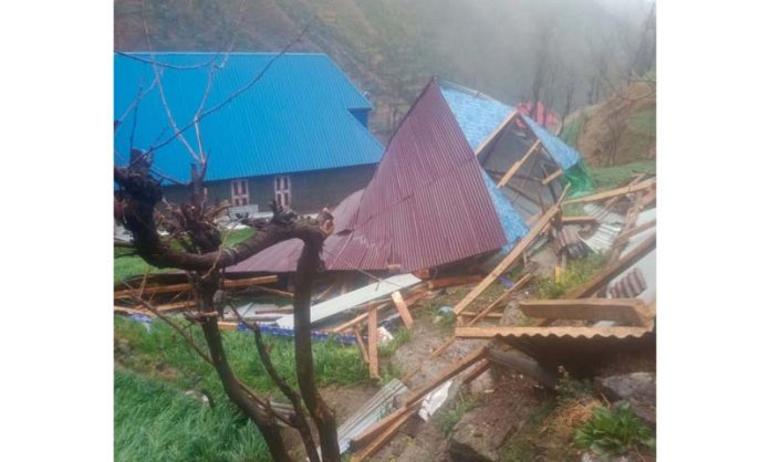 A house badly damaged in windstorm in Poonch area on Monday. -Excelsior/Waseem