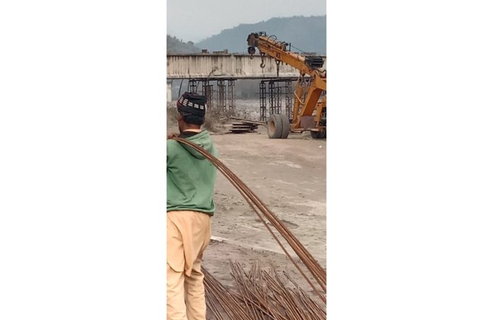 Work in progress on Ujh bridge near Jathana in Kathua. — Excelsior/Pradeep