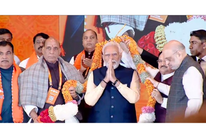 Prime Minister Narendra Modi being garlanded by Union Home Minister Amit Shah, Defence Minister Rajnath Singh, BJP National President JP Nadda and others during the BJP National Council Meeting in New Delhi on Sunday.(UNI )