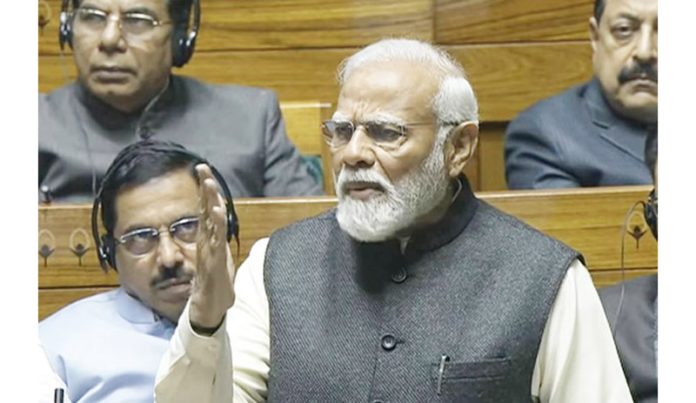 Prime Minister Narendra Modi speaks in the Lok Sabha on Monday. (UNI)