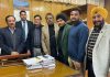 A delegation of veteran footballers posing with Rajeev Rai Bhatnagar, Advisor to LG.