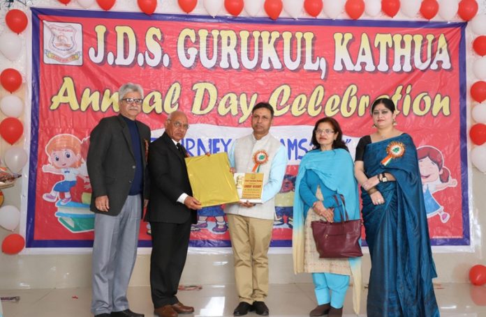 Management JDS Gurukul Kathua presenting memento to Chief Guest on Sunday.