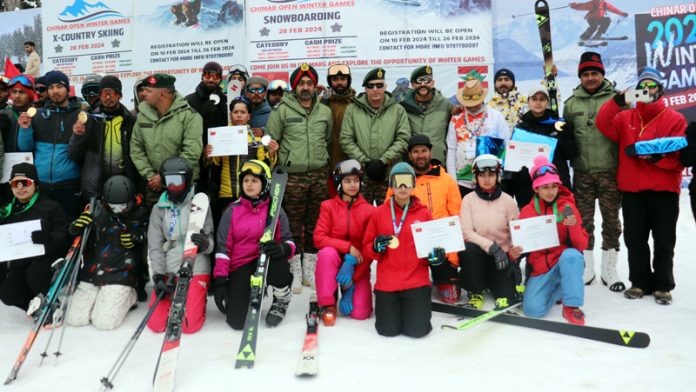 Chinar Corps Commander Lieutenant General Rajiv Ghai posing along with skiers at Gulmarg on Wednesday.
