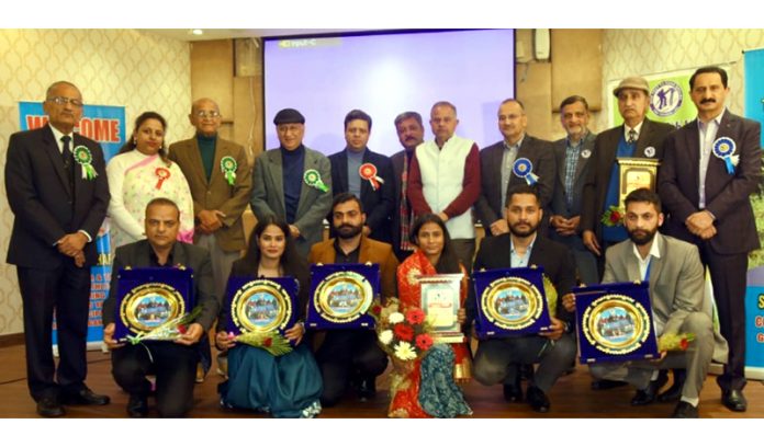 Sport Climbers, Mountaineers posing with mementos along with dignitaries in function at Jammu on Monday.