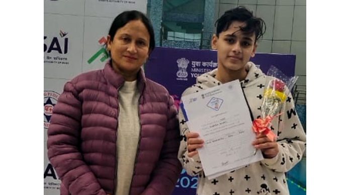 Swimmer Vanshika Gusain poses for a photograph with her Coach, Babita.
