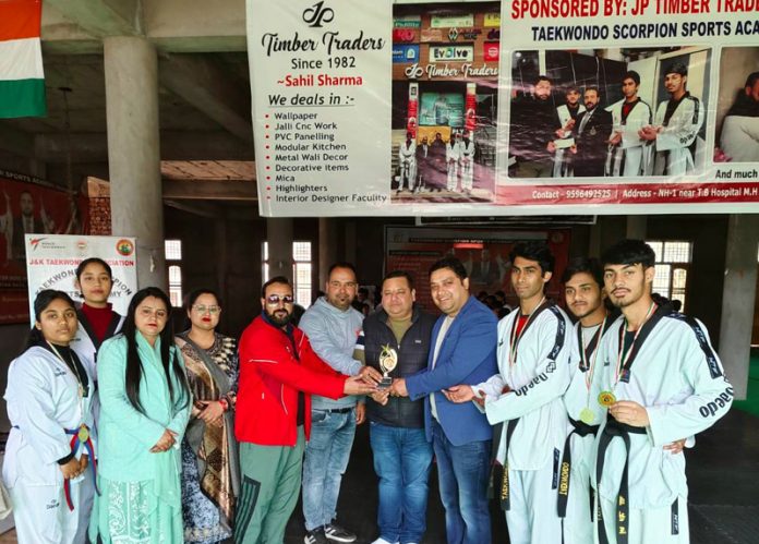 Scorpion Academy members Udhampur posing with Taekwondo players on Sunday.