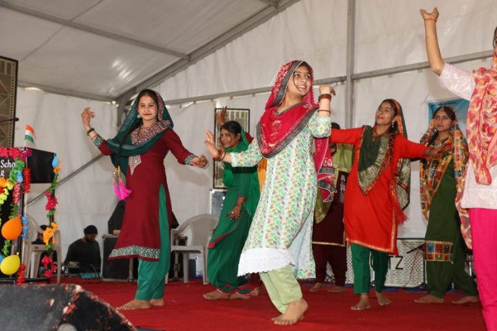 Artists performing during a function at Higher Secondary School Ramnagar on Saturday.