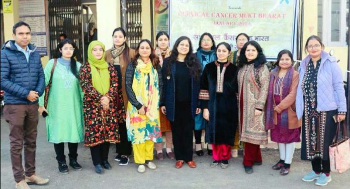 Faculty and staff of AIIMS Jammu posing together during a health camp at CHC Ramgarh.