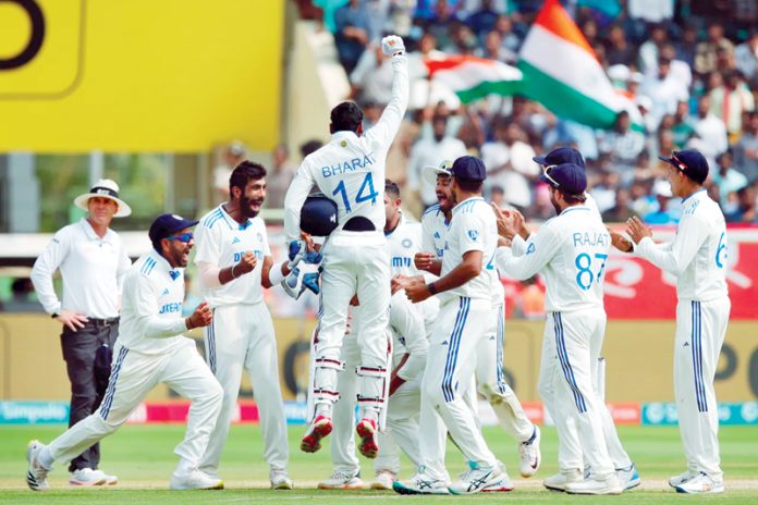 Indian cricket team celebrating victory against England in 2nd Test match at Visakhapatnam.