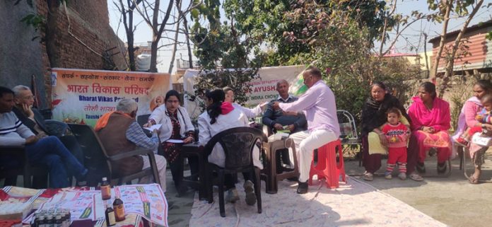 Doctors examining patients at a medical camp in Jammu on Wednesday.