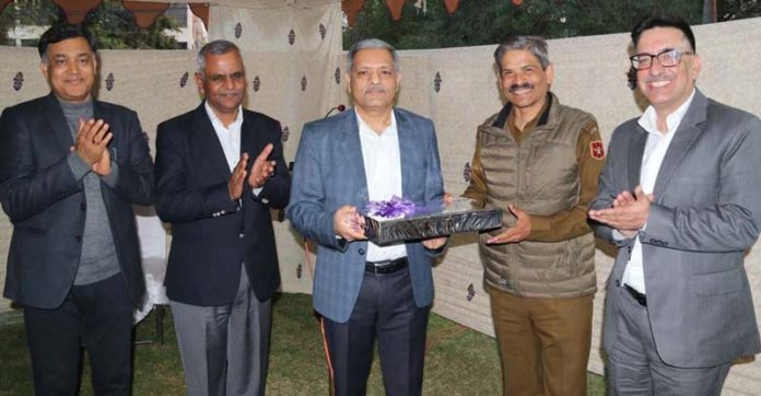 DGP RR Swain presenting a token of appreciation to Special DGP AK Choudhary at Police Headquarters in Jammu on Wednesday.