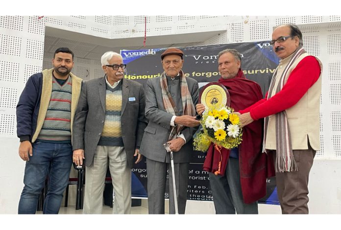 Senior radio broadcaster, Ramesh Marhatha being honored at a function at Jammu on Monday.