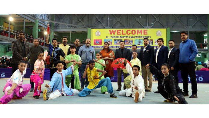 Wushu players posing with dignitaries on Friday.