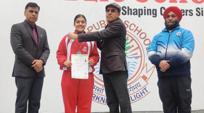 Shreemai Bhat (Class 8th) student of KC Public School posing with school management.