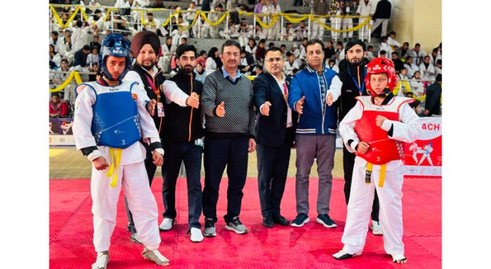 Dignitaries posing during second day of 26th J&K-UT Taekwondo Championship at Jammu on Friday.