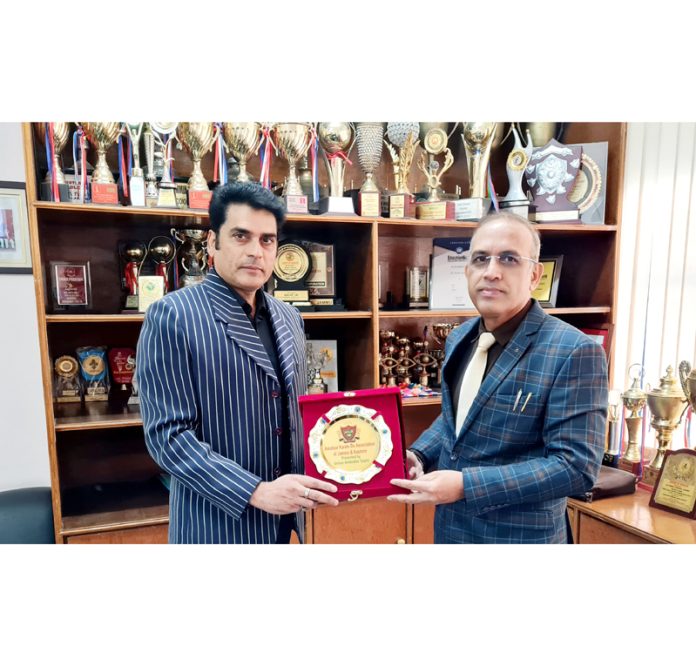 Shihan Ambedkar Gupta, Chairman Karate India Organisation (KIO) presenting Award of honour to Amarendra Kumar Mishra, Principal KC Public School for outstanding performance of KCPS in Karate Sports for the year 2023.